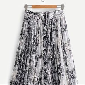 Snakeskin print button up skirt.
